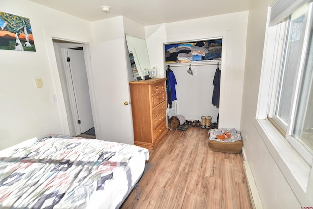 bedroom with a closet and light wood-style flooring