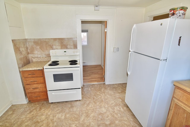 kitchen with light countertops and white appliances