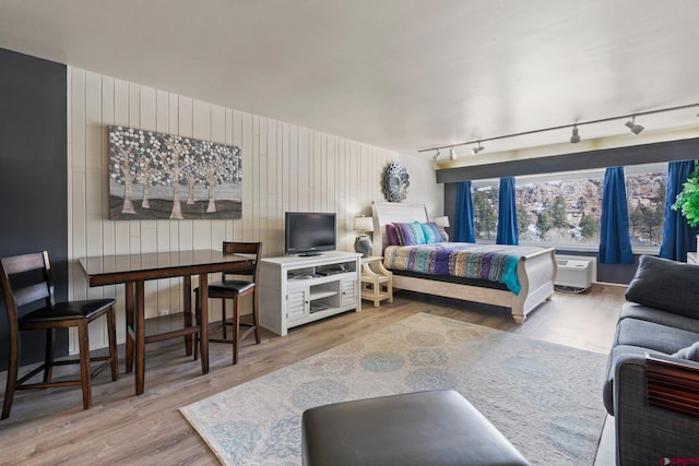 bedroom with wood finished floors