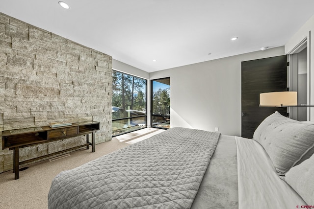 bedroom featuring light carpet, access to exterior, and recessed lighting