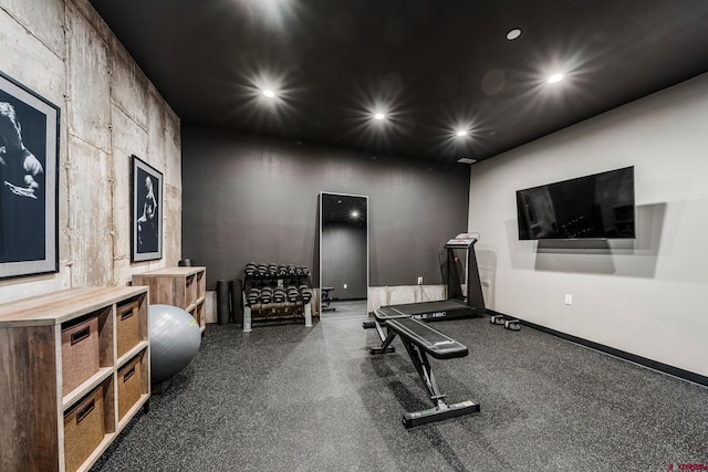 workout room featuring baseboards and recessed lighting