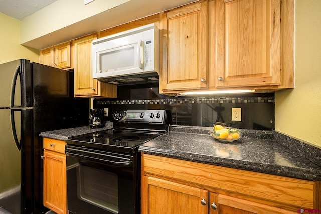 kitchen featuring dark stone counters, black appliances, backsplash, and brown cabinets