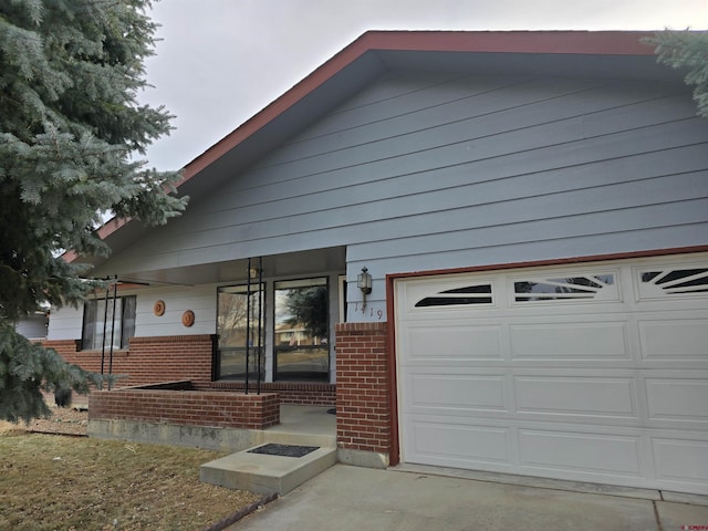 view of front of property featuring brick siding