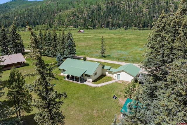 aerial view featuring a view of trees