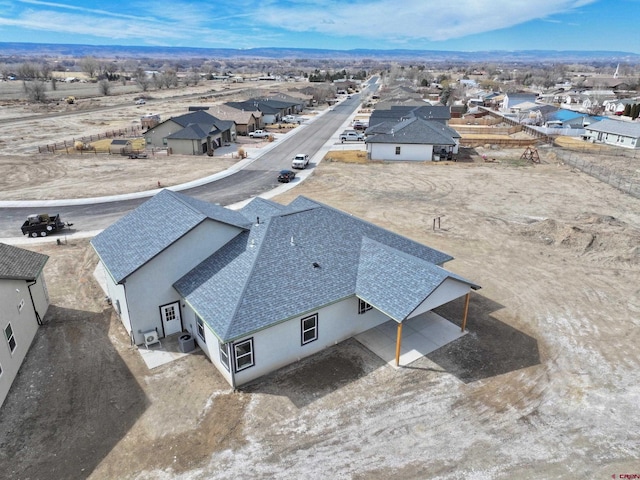 birds eye view of property with a residential view