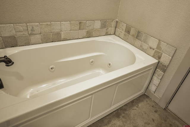 full bathroom featuring a whirlpool tub