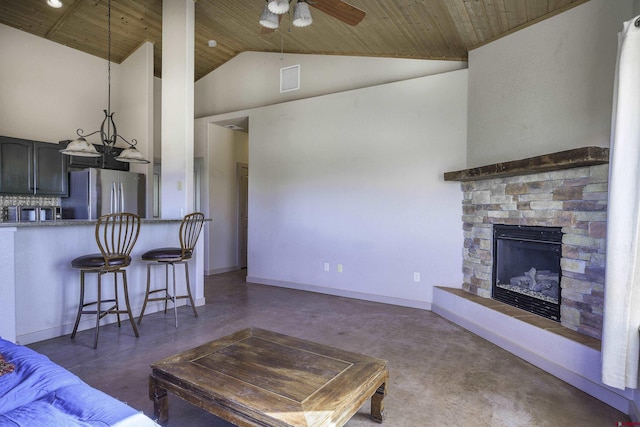 living room with a fireplace, visible vents, a ceiling fan, wood ceiling, and baseboards
