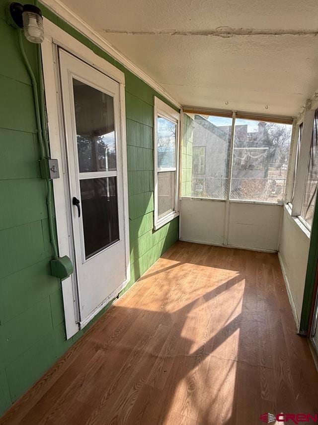 unfurnished sunroom with a wealth of natural light