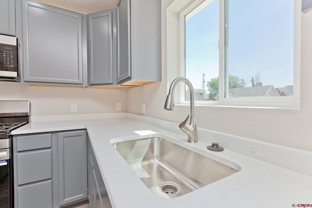 670 Nuvue St Cyprus Floorplan, Cyprus Floorplan, Delta, CO 81416 - kitchen featuring gray cabinets, stainless steel range with electric stovetop, and light countertops
