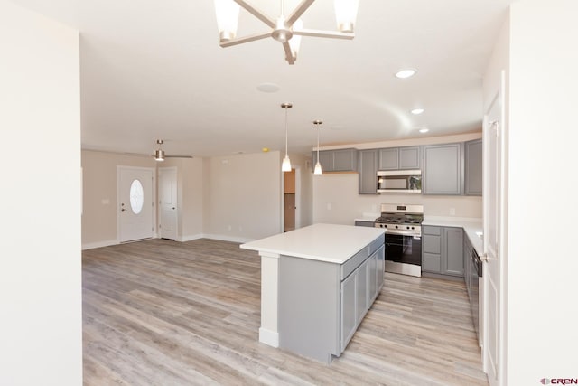 670 Nuvue St Cyprus Floorplan, Cyprus Floorplan, Delta, CO 81416 - kitchen with stainless steel appliances, gray cabinets, light wood-style flooring, ceiling fan, and recessed lighting