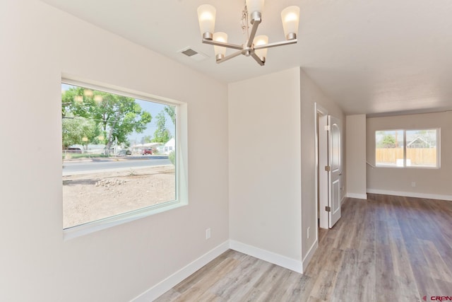 670 Nuvue St Cyprus Floorplan, Cyprus Floorplan, Delta, CO 81416 - unfurnished dining area featuring a chandelier and wood finished floors