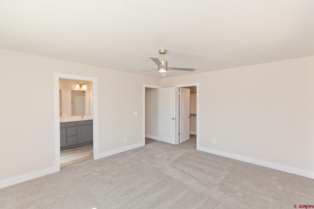 670 Nuvue St Cyprus Floorplan, Cyprus Floorplan, Delta, CO 81416 - unfurnished bedroom with light carpet, a spacious closet, connected bathroom, a closet, and ceiling fan