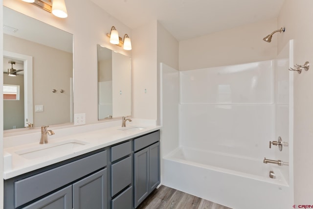 670 Nuvue St Cyprus Floorplan, Cyprus Floorplan, Delta, CO 81416 - full bathroom featuring wood finished floors, double vanity, and  shower combination