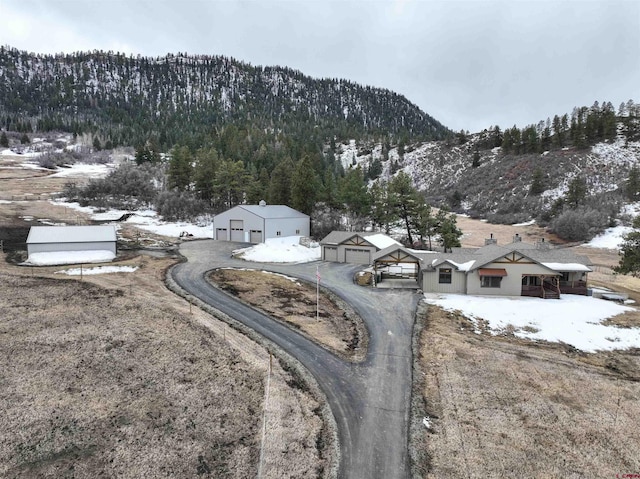 snowy aerial view with a mountain view