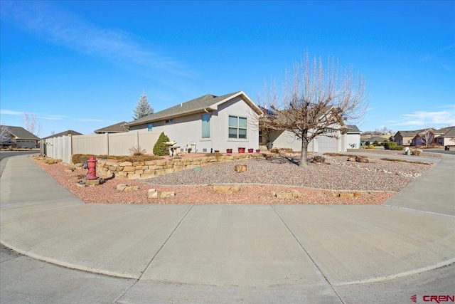 single story home with a residential view, fence, and stucco siding