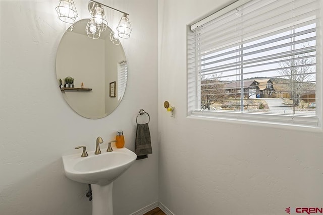 bathroom featuring baseboards