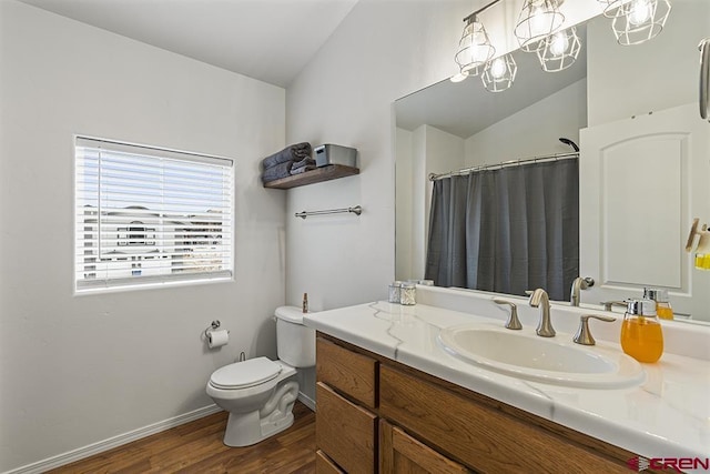 full bathroom with vaulted ceiling, vanity, toilet, and wood finished floors