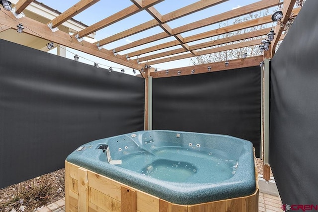 view of patio with a pergola, washer / dryer, and a hot tub