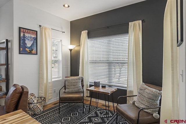 sitting room with recessed lighting, baseboards, and wood finished floors