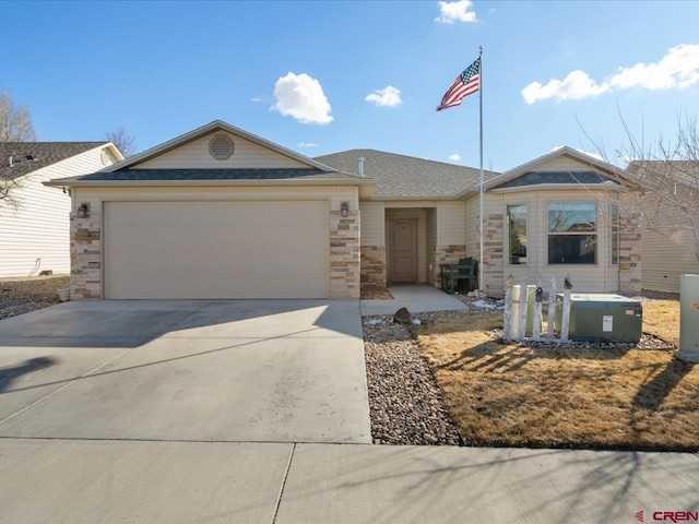 single story home with an attached garage, stone siding, and driveway