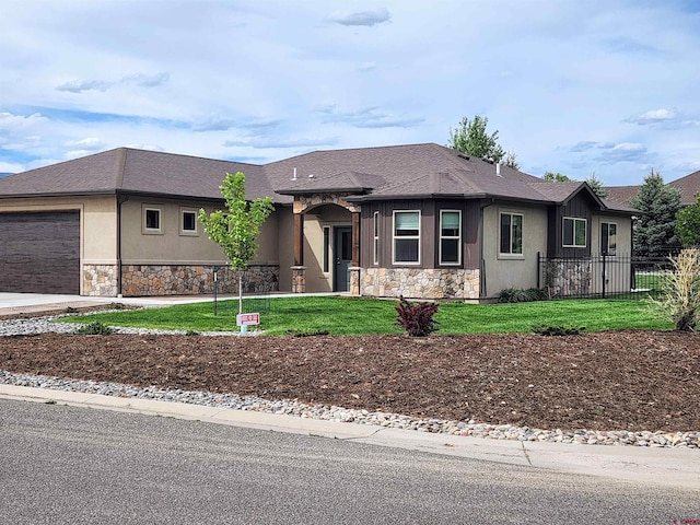 view of front of home featuring stucco siding, an attached garage, fence, stone siding, and driveway