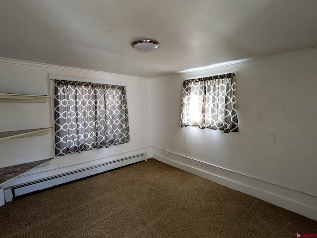 unfurnished room with carpet floors and a baseboard radiator