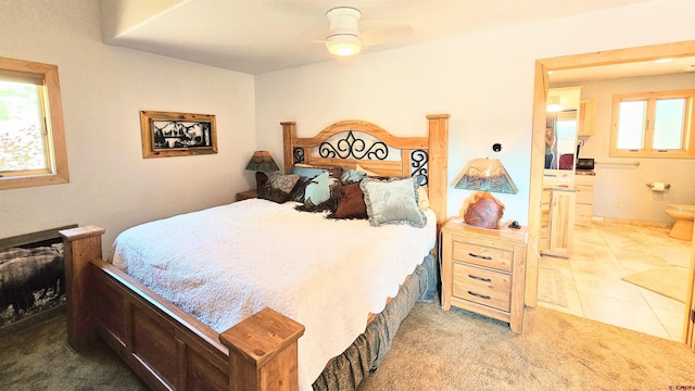 bedroom featuring tile patterned floors and ensuite bathroom