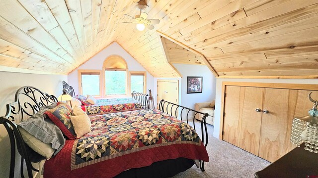 carpeted bedroom featuring lofted ceiling and wood ceiling