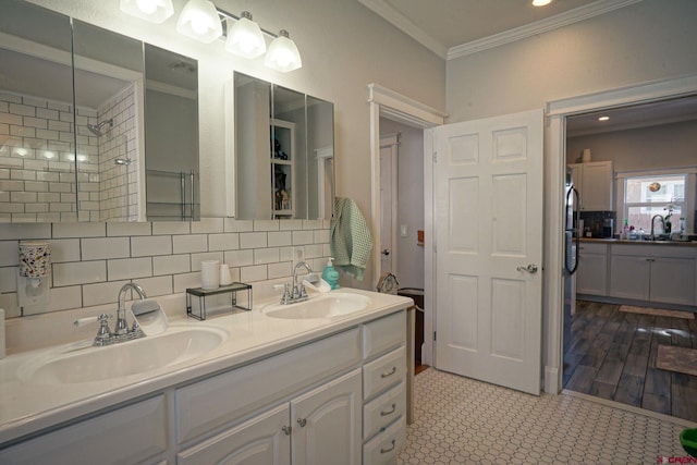 bathroom featuring tasteful backsplash, a sink, and crown molding