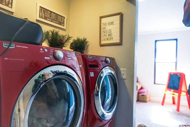 laundry room with laundry area and washer and clothes dryer