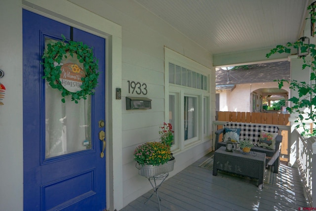 view of exterior entry with covered porch