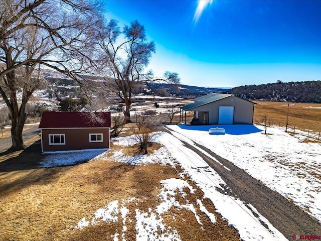 exterior space featuring a mountain view and an outdoor structure