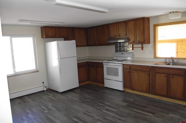 kitchen with a baseboard radiator, light countertops, a sink, white appliances, and under cabinet range hood