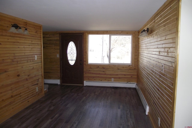 entrance foyer featuring dark wood-style floors, a baseboard radiator, and a baseboard heating unit