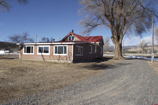 exterior space featuring gravel driveway