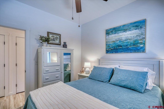 bedroom with a ceiling fan and wood finished floors