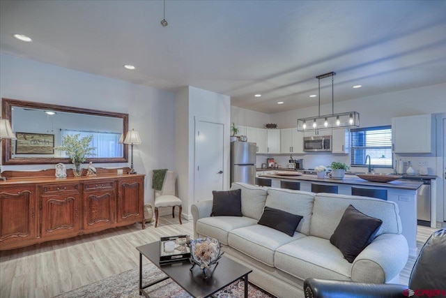 living room featuring recessed lighting and light wood-style floors