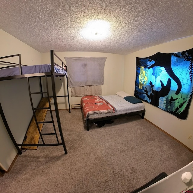 bedroom featuring a textured ceiling and carpet floors