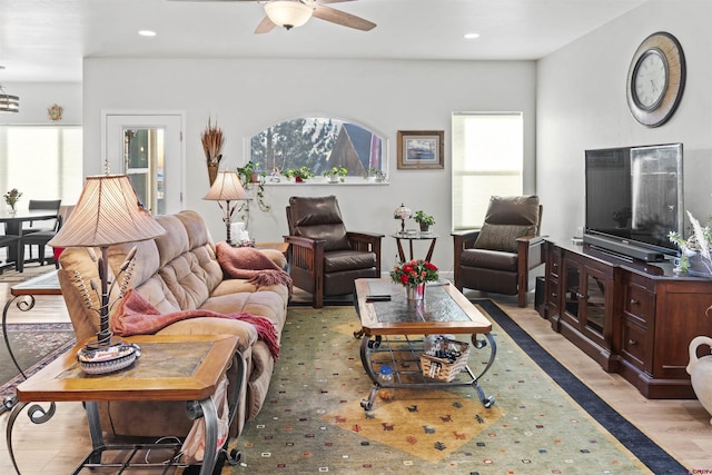 living area featuring light wood-type flooring, ceiling fan, and recessed lighting