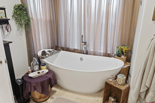 full bathroom featuring a freestanding bath