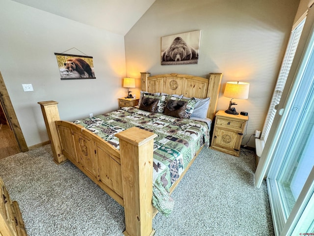 bedroom with lofted ceiling and light colored carpet