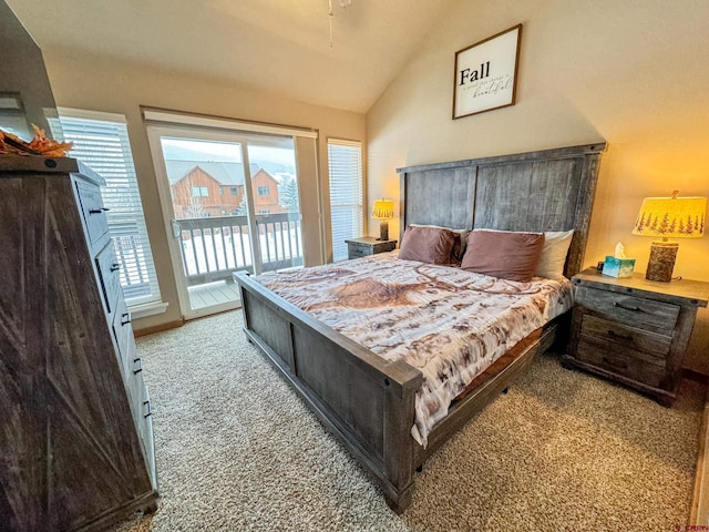 bedroom featuring access to exterior, carpet flooring, and vaulted ceiling