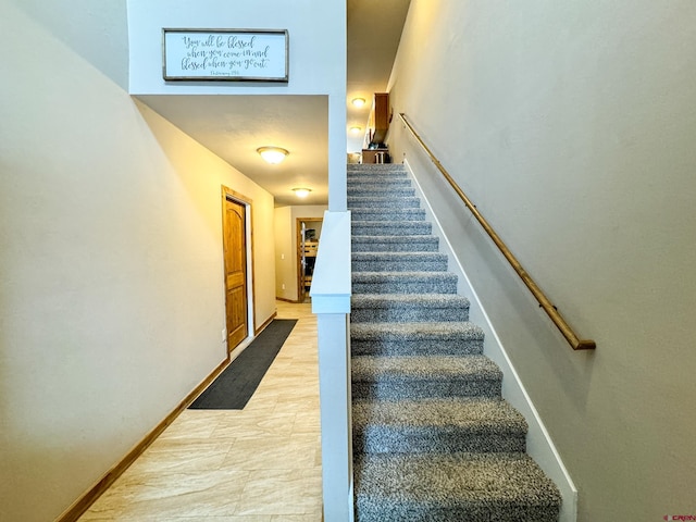 staircase with baseboards