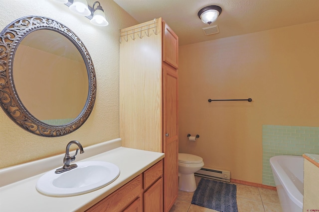 bathroom with a bathing tub, a baseboard heating unit, vanity, visible vents, and tile patterned floors