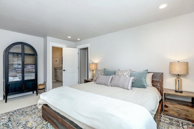 bedroom with recessed lighting and light colored carpet