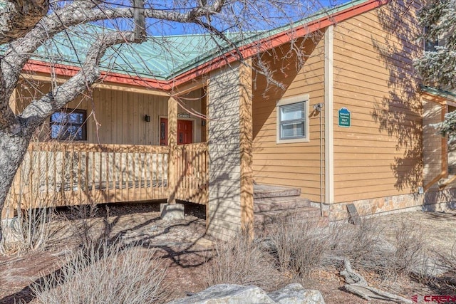 view of property exterior with metal roof