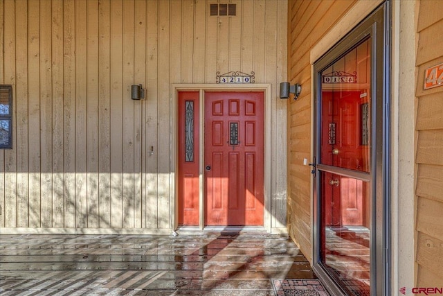 doorway to property featuring visible vents