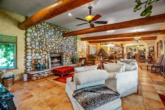 living room featuring arched walkways, beamed ceiling, a fireplace, and ceiling fan with notable chandelier