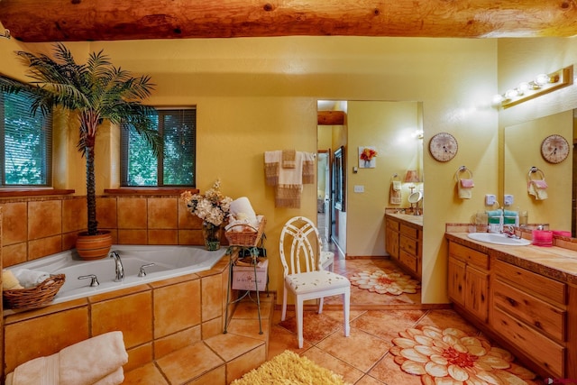 bathroom featuring a stall shower, tile patterned floors, vanity, and a bath