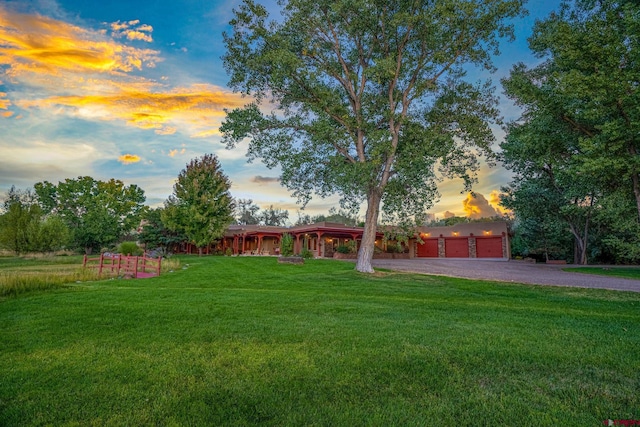 yard at dusk with driveway